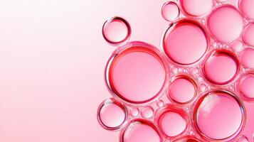Red bubbles float in a transparent liquid illuminated by soft blush lighting, creating an abstract macro texture suitable for beauty or science themes photo