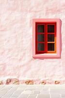 Contemporary blush wall with red window frames showcasing minimalism in architectural design and color-block aesthetics photo