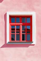 Contemporary architecture featuring blush painted wall with striking red window frames in a minimalist design photo