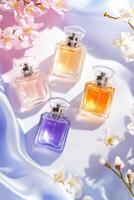 Assorted pastel perfume bottles elegantly arranged on silk fabric with flowers, creating a romantic and feminine atmosphere for a stylish flatlay photo