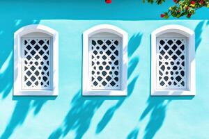 Creative architectural facade featuring bold baby blue color and geometric patterns in urban setting photo