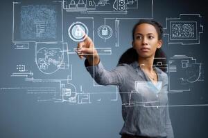 Businesswoman working with virtual interface touching digital screen activating security system photo