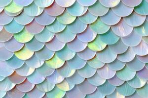 Colorful iridescent scales arranged in a layered pattern creating a mesmerizing visual effect photo
