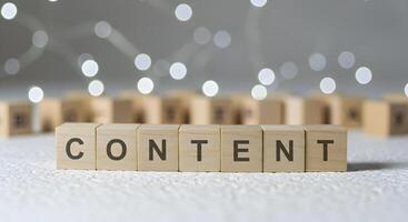 Content Strategy Concept, Wooden Blocks Spelling Content with Bokeh Lights photo