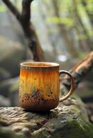 Ceramic Mug Resting on a Tree Trunk photo