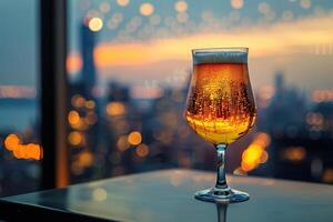 Glass of Beer with City Lights in the Background photo