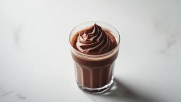 A chocolate milkshake in a glass photo
