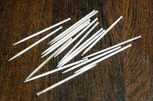 Selective focus of some toothpicks placed on a table photo