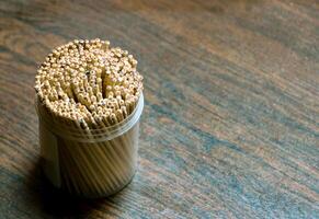 toothpicks box placed on a table photo