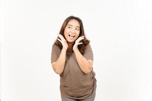 A woman is making a face while standing on a white background photo