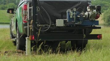 Soil examination of agronomy. Geotechnical investigation. Collecting black soil on the field for examination and analysis. Special equipment for pickup 10 video