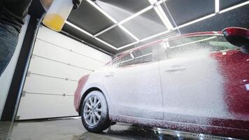 Car wash with flowing water and foam. video