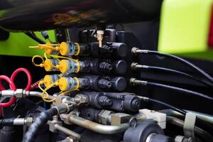 Hoses of modern hydraulic machine.Concept of a new machine in a agrocomplex. photo