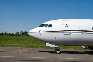 Passenger plane on the runway photo