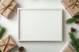 A blank frame surrounded by gift-wrapped packages and natural elements for a festive display. photo