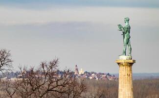 Perched high above the confluence of the Sava and Danube rivers, the iconic Victor statue stands as a timeless guardian of Belgrade. photo