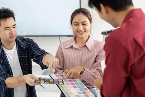 Color Selection and Creativity. Team discussing color palettes for a project. photo