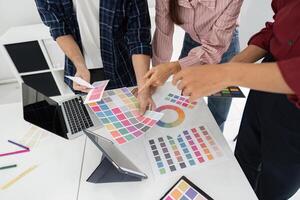 Team Collaboration and Decision Making. Discussing designs and color schemes. photo