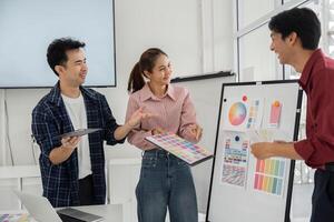 Enthusiastic Color Collaboration. Team members excitedly sharing their views on color palettes. photo