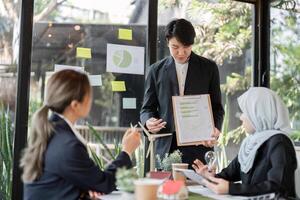 Innovation and Strategy. A team presenting eco-friendly initiatives in a sustainable architecture project. photo