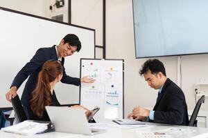 Effective Communication and Budget Review. A young professional presenting budget analysis while engaging with attentive colleagues in a dynamic office environment. photo