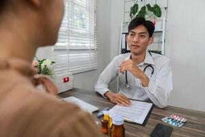 Holistic Health Management and Medicine. A doctor explaining medication options to a patient in a clinic setting. photo