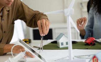 Modeling and Design in Sustainability. A designer using tools to create energy-efficient designs for eco-friendly projects. photo