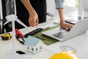 Sustainable Solutions and Technology. A designer integrating digital tools in sustainable project designs. photo