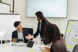 Effective Communication in ESG Strategies. Team members exchanging ideas and insights on sustainability initiatives. photo