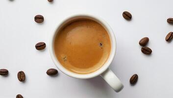 Freshly Brewed Coffee in a White Mug Surrounded by Coffee Beans, Isolated on white background photo
