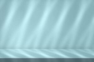 Minimal Empty Table with Light Beam and Shadow on Light Shade of Cyan Wall photo