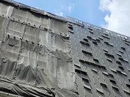 Dust Cover Net of Under Modern Construction Building. photo