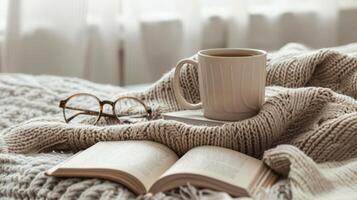 Quiet Contemplation. A Cup Of Tea, A Good Book, And The Warmth Of Knitwear. photo