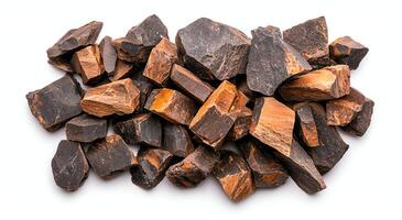 A collection of raw, natural rocks displaying a variety of textures and earthy colors, set against a clean white background for versatile design applications. photo