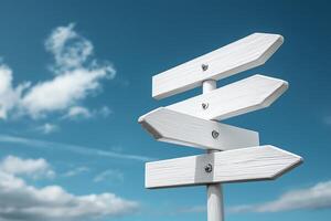 A blank white directional signpost under a clear blue sky, symbolizing choices and directions. Ideal for travel themes, navigation concepts, and decision-making imagery. photo