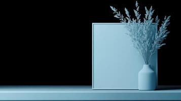 Monochromatic Blue Home Decor Scene with Vase and Frame photo