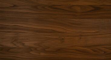 Smooth, glossy surface of black walnut wood with rich variations in tone and a well-finished, high-quality texture. photo