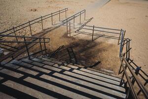A man is riding a skateboard down a set of stairs photo