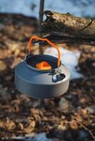 The Hanging Camping Kettle is a perfect companion for outdoor enthusiasts who love exploring forests and are eager for thrilling adventures while deeply connecting with nature photo