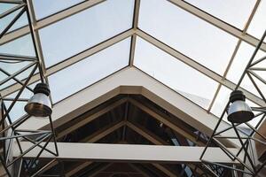 As I gaze upwards at the intricate ceiling of a building that boasts a stunning glass roof, I cant help but admire the architecture and design that makes it so impressive photo