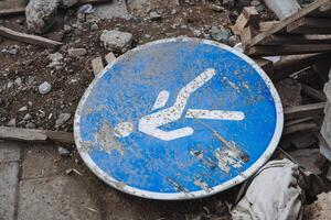 A visually striking blue and white sign prominently features a bright, rightpointing arrow, effectively assisting viewers with navigation and providing clear direction on their way photo