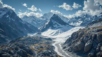 Majestic Snow-Capped Mountains Under Bright Blue Sky with Clouds photo