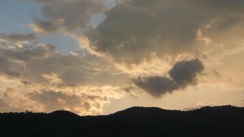A view of the mountains and clouds at sunset video