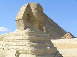 Historical value. The legendary Great Sphinx of Giza, carved from limestone, stands majestically against the vast Egyptian desert photo