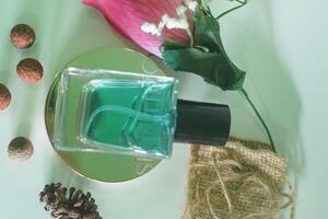 luxury Perfume bottles at display on a green background with copy space. closeup of photo. Selective focus h photo
