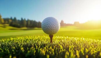 Golf Ball on Tee at Sunrise on a Lush Green Golf Course photo