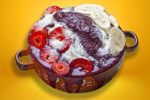 Acai cream with strawberry, banana and powdered milk. photo