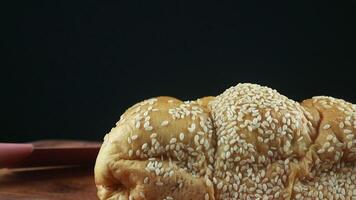 Homemade wheat bread with sesame seeds. Rotating display video