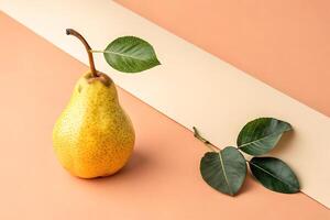 Fresh yellow pear with green leaves on minimalist background for autumn design photo