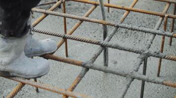 Vibrating fresh concrete under reinforcement grid video